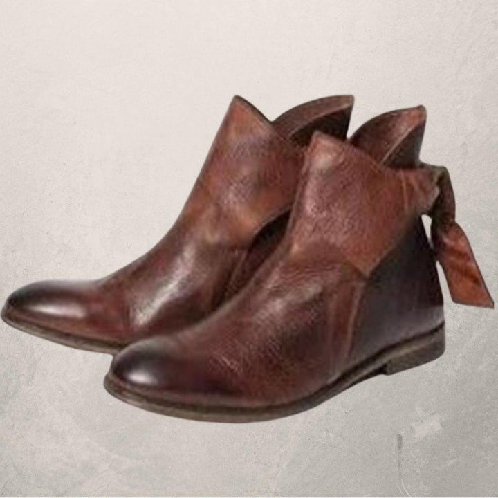 Victoria’s Elegant Bow-Detail Leather Ankle Boots