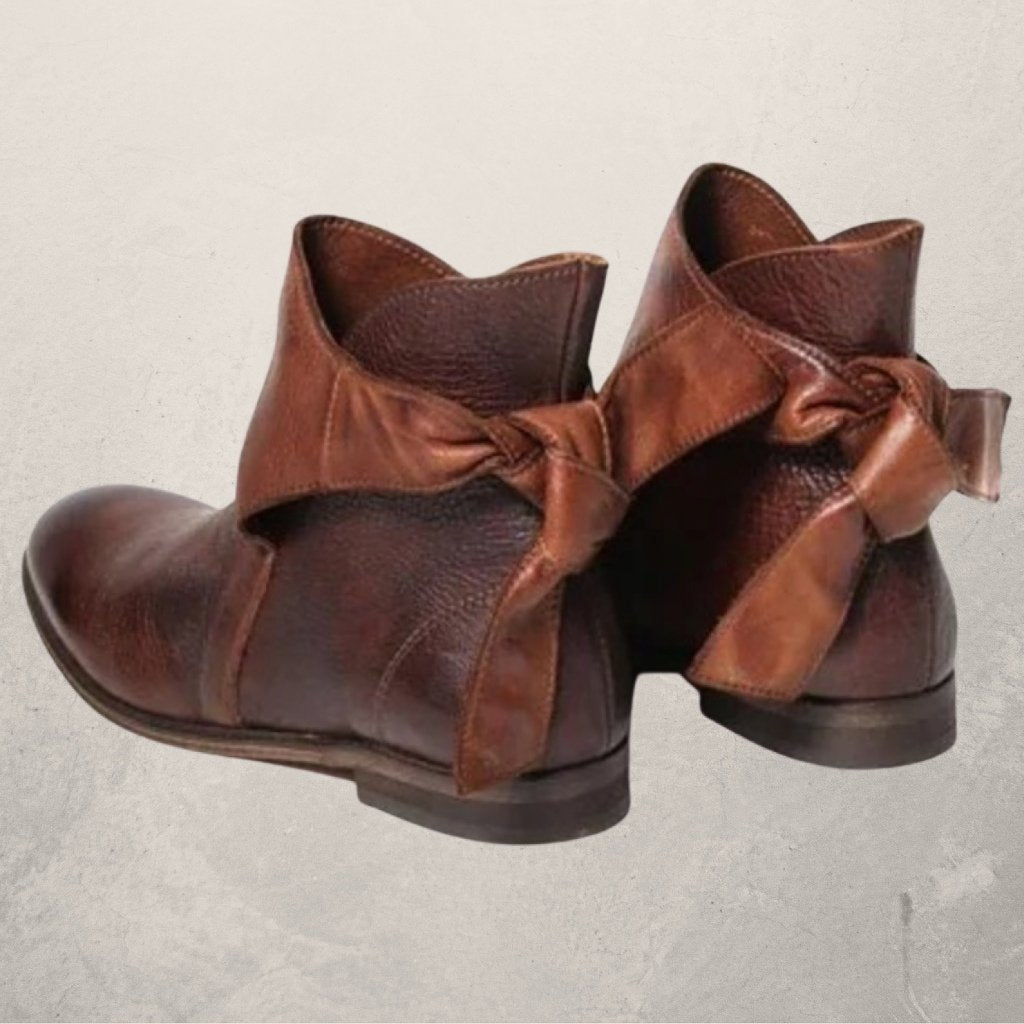Victoria’s Elegant Bow-Detail Leather Ankle Boots