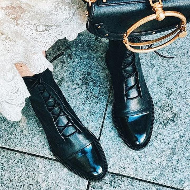 Victoria’s Sleek Leather Lace-Up Boots